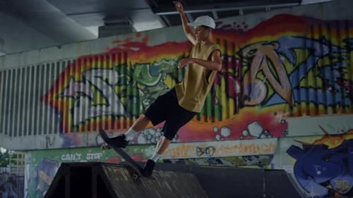 Active Skateboarder Preparing Skate Board Competition On Ramp At Urban Skate Park. Sporty Athlete...