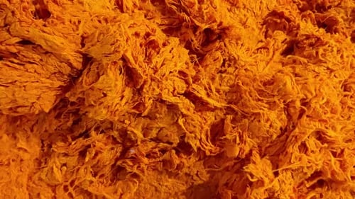 Orange Shredded Strands in a Heaping Pile