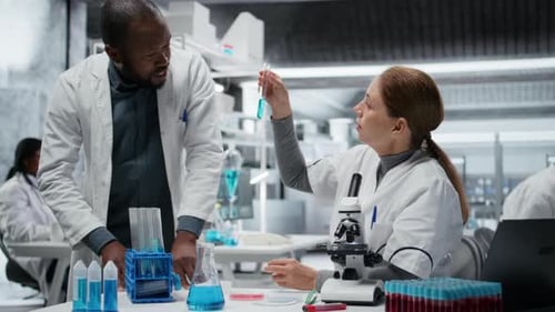 Scientists working together in modern research laboratory