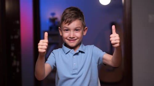 Boy Gives Two Thumbs Up in Home Setting