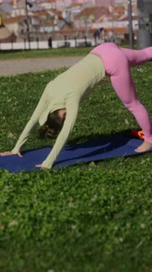 Woman Doing Yoga Exercise Outside in the Park