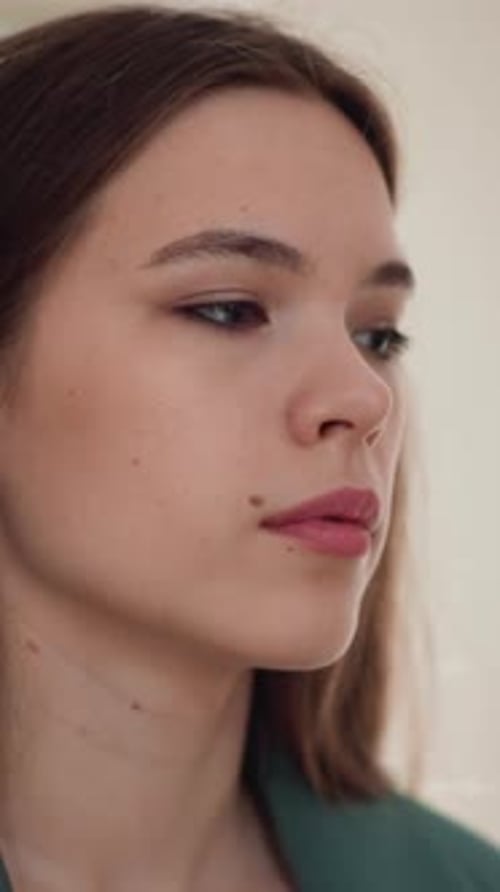 Young Woman with Brown Hair Looking to the Side
