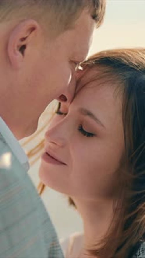 Close Up of a Loving Couple Embracing and Showing Tender Feelings A Woman in Love Looks at Her