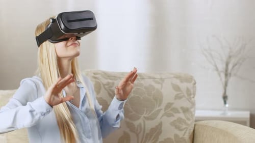 Woman Experiencing Virtual Reality With VR Headset