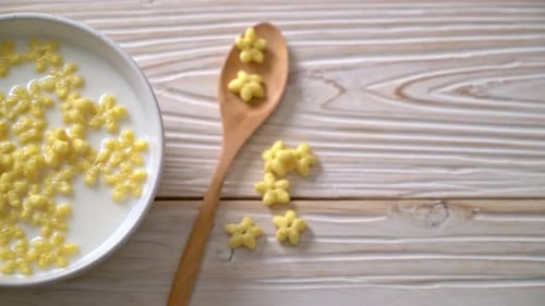 Star Shaped Cereal in Milk with Spoon