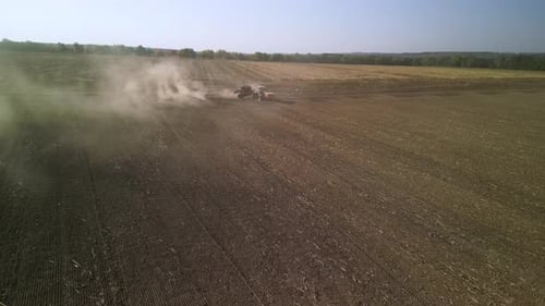 Tractor on the field seeding wheat