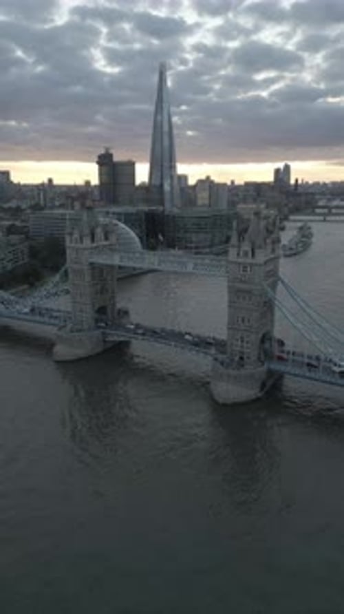 Aerial video of the city of London and the lighthouse bridge in London at night