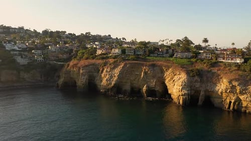 Scenic View Of La Jolla Sea Caves In San Diego, California On A Sunset - wide drone shot