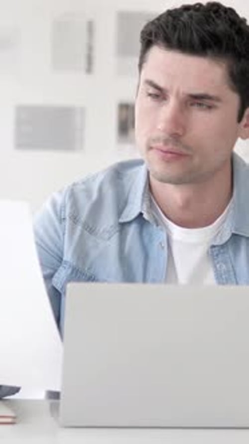 Casual Young Man Working in Office on Contract, Paperwork, Vertical Video