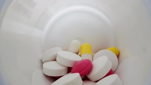 Close Up Pills Inside White Pill Bottle