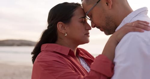 Love, hug and sunset with couple at beach for romance, vacation and relax