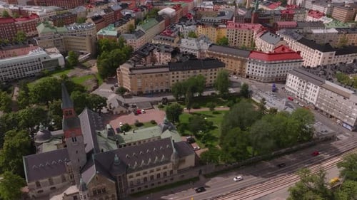 High Angle View of Cars Driving on Street Near National Museum Tilt Up Reveal Color Buildings in