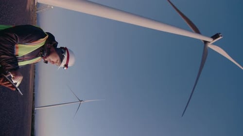 Wind Energy Engineer Working with Digital Tablet