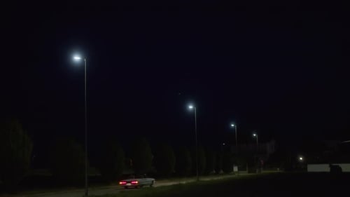 Nighttime Street Lights and Driving Retro Car