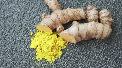 Fresh turmeric rhizome and powder. Yellow curcumin. Curcuma