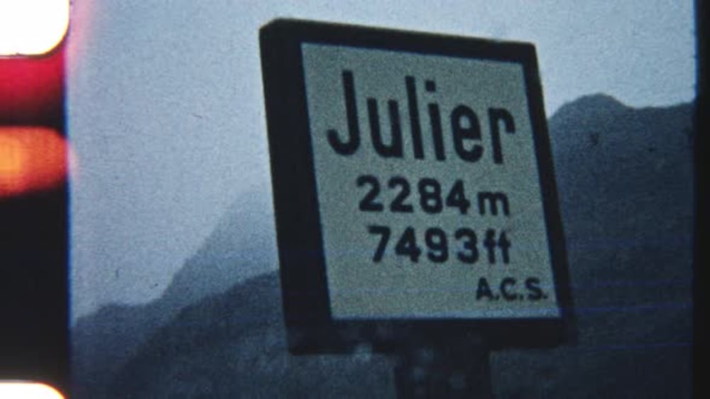 POV From Parked Car With Wiper Moving And Julier Pass Sign Ahead ...