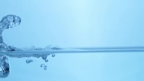 Raindrop Creating Ripples in a Calm Sea. Stunning View of Natural Water Patterns.