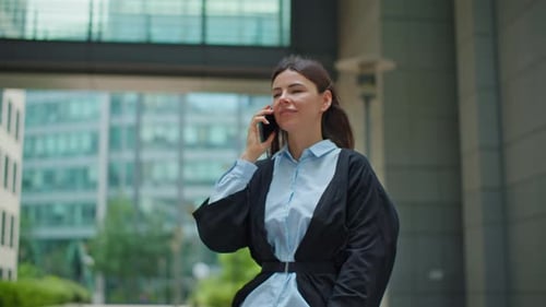 Professional Woman Deal Via Mobile Phone Walking Towards Office Skyscraper