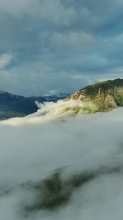 Aerial view of clouds and mountains at sunrise