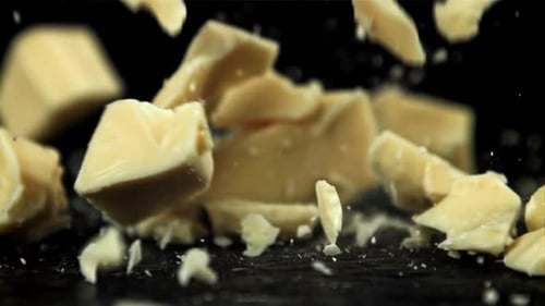 Chunks of White Chocolate Fall on the Table Filmed on a Highspeed Camera at 1000 Fps