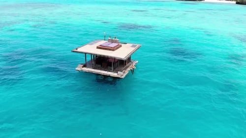 Floating Beach House in Tropical Azure Waters