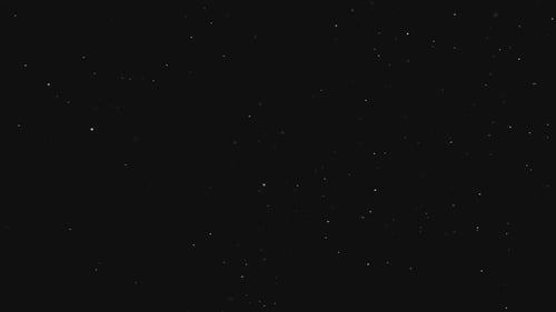 Abstract Shimmering Particles on Black Background