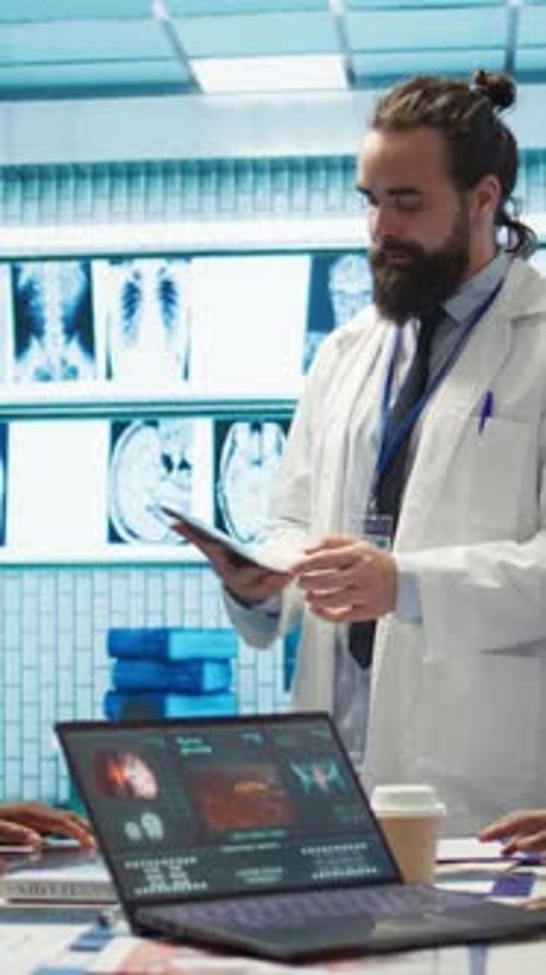 Doctors Analyzing Brain Scans Together in Medical Office