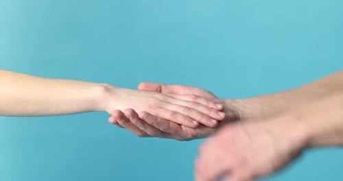 Man Holding Woman's Hands for Comfort and Support