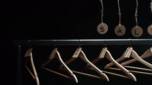 Shop with Sale Tags and Crutches Background