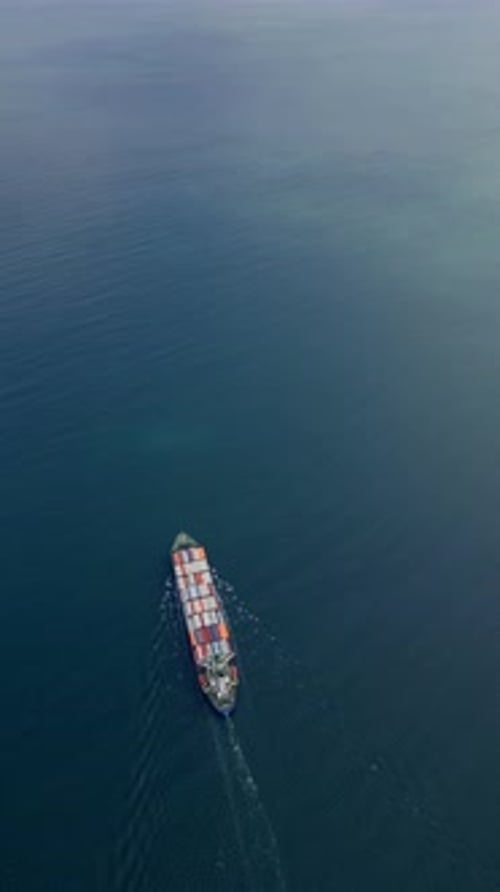 A Container Ship Sails Across the Calm Blue Waters