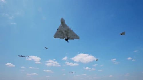 Advanced Drones Fly Across Clear Blue Sky