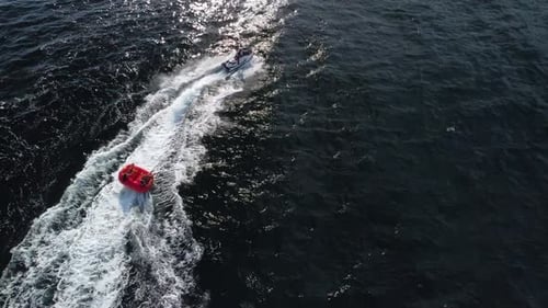 Jet Ski Pulling Tube on the Ocean