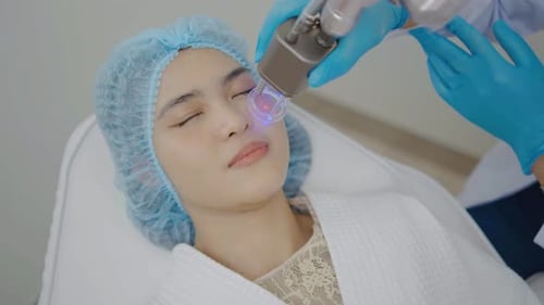 Beautiful woman having facial skin care treatment at beauty clinic, Facial skin care, anti-aging