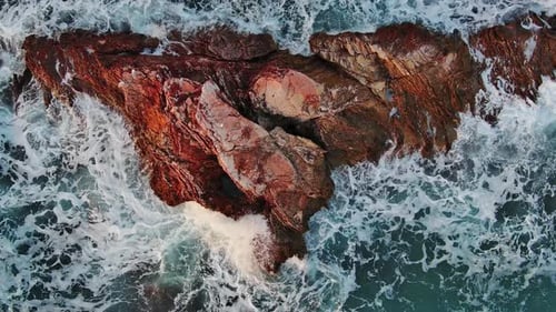 Top View of Waves and Rocks in Sea