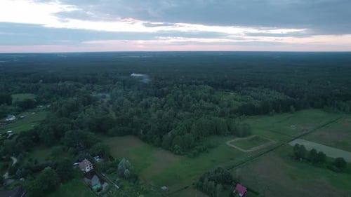Beautiful view from the drone on a summer sunset in the forest.
