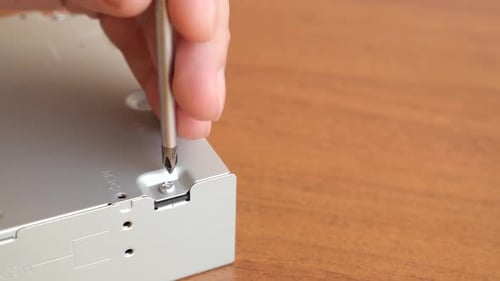 Tightening Screw into Computer Hard Drive