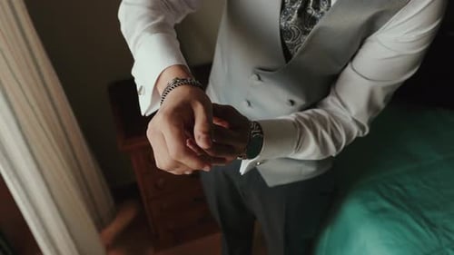 Man Puts On Watch for Special Event