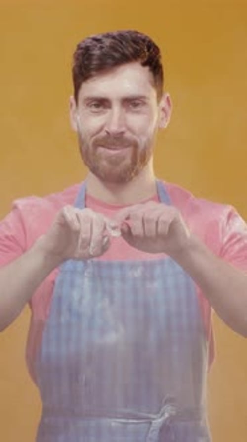 A Chef Enthusiastically Tossing Flour with an Animated and Joyful Expression and Gesture