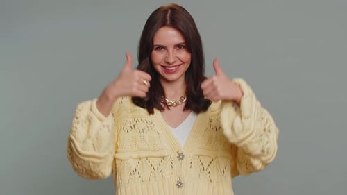 Enthusiastic Young Adult Gives Thumbs Up Sign