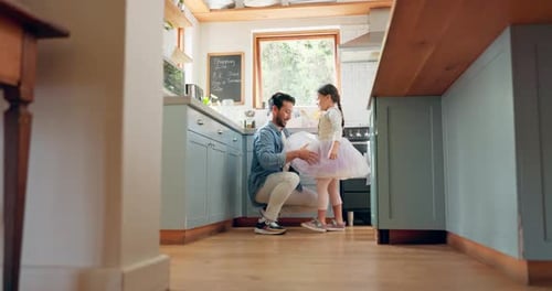 Father Daughter Playing Together in Bright Kitchen