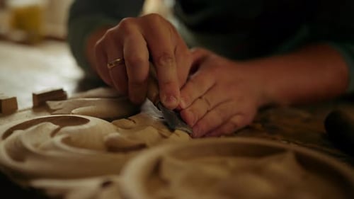Wood Worker Hands Carving Wood in in Carpentry Workshop. Unrecognized