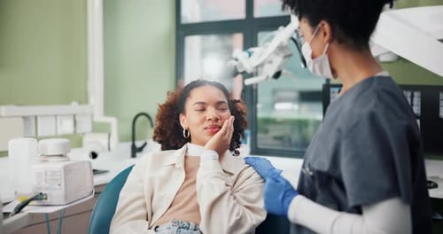 Young Woman Consulting Dentist in Modern Clinic