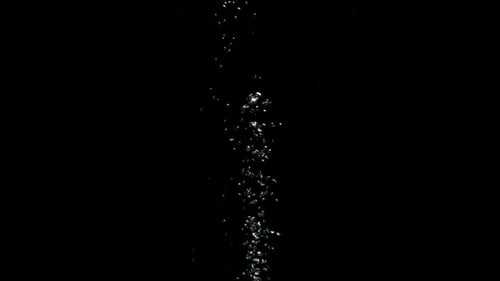 Submerge Collection: A stream of small bubbles moving from the bottom to the top over a black backgr