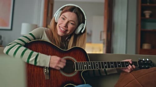 Girl Studying Guitar Play in Headphones Looking Laptop Online Lesson Close Up