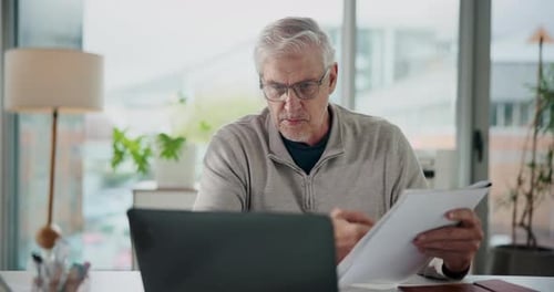 Mature, businessman and video call with documents on laptop for business proposal in office