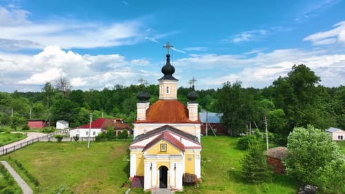 An old Orthodox church in a green rural landscape