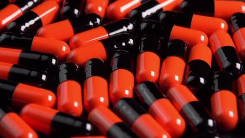 Orange and Black Capsules Panning Slowly