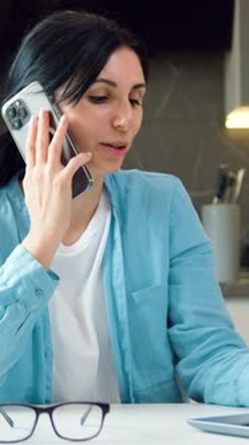 Woman Talking on Phone at Home