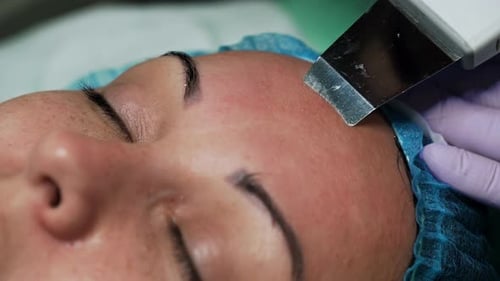Cosmetic Treatment on Woman's Face