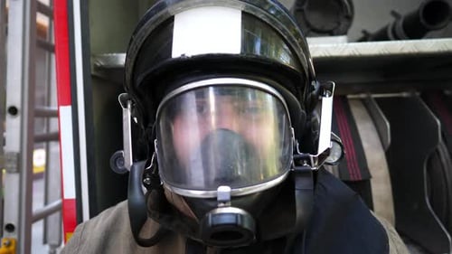 Firefighter Removes His Helmet After a Fire